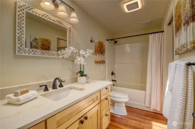 Second Floor Bath. 2018 Remodeled too - New cabinets, granite counters, tub/shower, lighting.