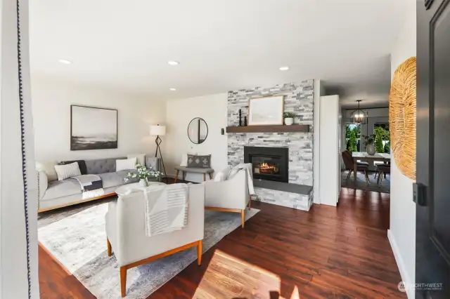 Light filled large living room with gas fireplace