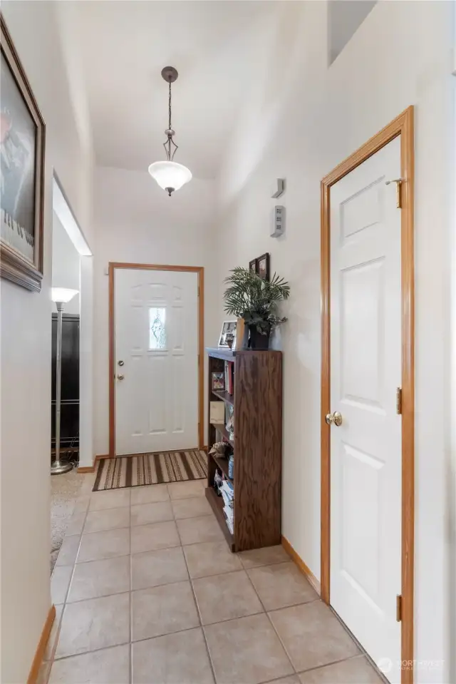 Entry way, vaulted ceiling and gorgeous tile flooring