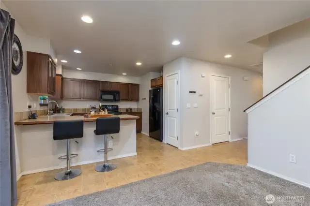 Kitchen includes a pantry for even more storage. Door on the right opens to the garage.