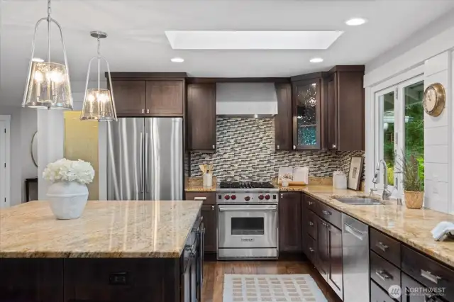 Yes, that's a wolf range! Refrigerator and dishwasher are newer!