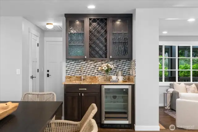 Butler's pantry with beverage fridge and ample cabinetry, countertop space to store your favorite beverages!