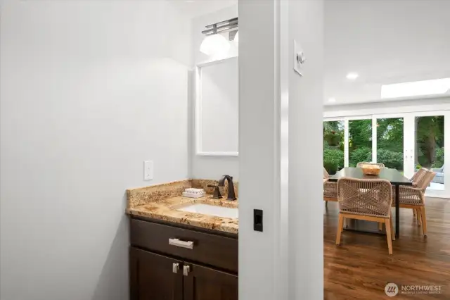 Powder bath with gorgeous granite countertops.