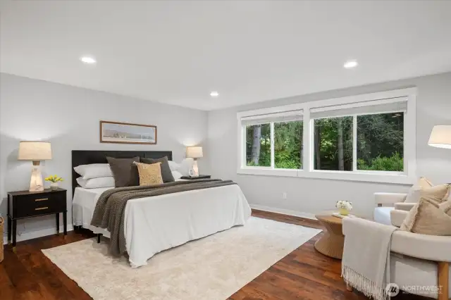 Spacious, tranquil primary suite is appointed with hardwoods!