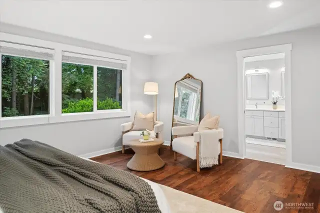 Backyard views from the primary suite add privacy and a sense of calm.