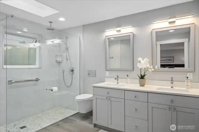 The primary bath is a showstopper! Tranquil colors, modern elements, this space is a wow! Dual vanities, beautiful quartz countertops, sophisticated and lighting!