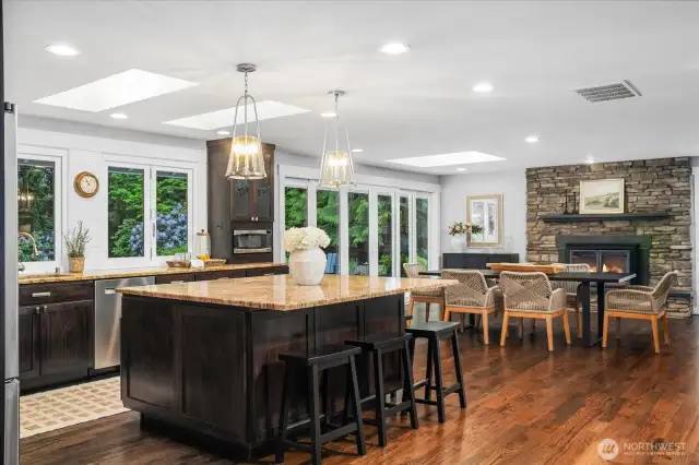 Living room seamlessly flows into the Ktichen, dining spaces.
