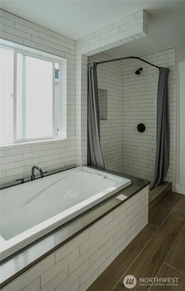 Primary soaking tub and stand up shower