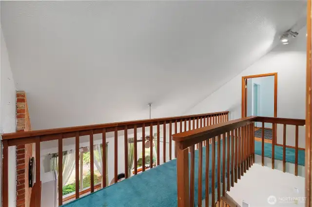 Cat walk connecting the primary bedroom and bedroom 3