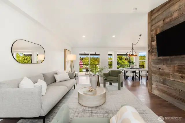 Natural light floods the open concept living and dining space, while large sliders offer seamless indoor-outdoor living. It’s the heart of the home—with a view!
