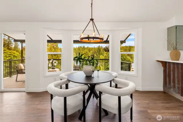 Imagine enjoying every meal surrounded by natural beauty. This perfectly placed table takes full advantage of the panoramic forest and lake vistas—without leaving your seat.