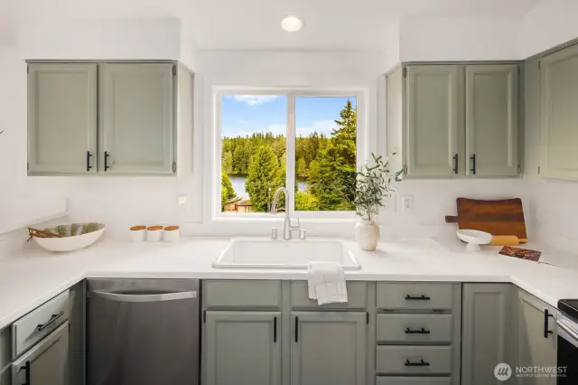 You might actually want dish duty here—watch the sun sparkle over the water and trees from this picture-perfect window.