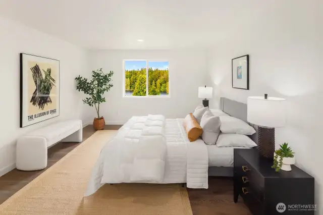 This sunlit bedroom has been fully refreshed with new flooring, doors, and trim—plus a front-row seat to the natural beauty that defines the property.