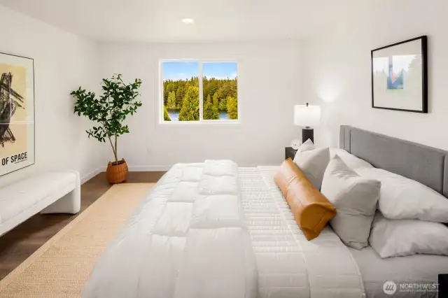 With warm natural light pouring in, this spacious bedroom invites rest, rejuvenation, or even a peaceful reading corner with postcard-worthy views.