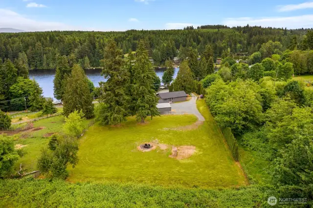 Tucked into nature’s embrace, this beautifully cleared yard is perfect for outdoor gatherings, stargazing nights around the fire pit, or simply soaking in the serenity. Room to roam, relax, and enjoy all that Pacific Northwest living offers!