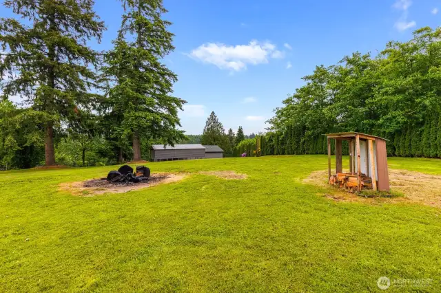 Bonfire-Ready Backyard  Enjoy a classic PNW evening around the fire pit in your private backyard. There’s even a covered wood shed ready for your next s’mores night or cozy fireside hangout.