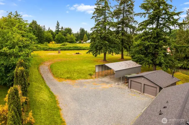 The large gravel drive, detached two-car garage, and covered carport provide space for all your toys, tools, and hobbies. Whether you need room for boats, trailers, or a workshop — it’s all here!