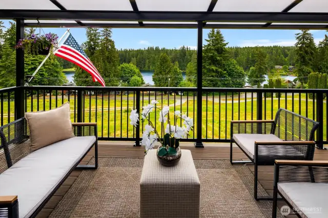 Whether it’s morning coffee or evening wine, this covered deck with panoramic views offers a year-round retreat—blending indoor comfort with outdoor beauty.