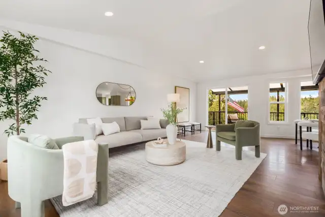 Soaring ceilings and fresh, modern finishes create a bright and airy living space. The open floor plan flows effortlessly to the covered deck, bringing nature right into your living room.