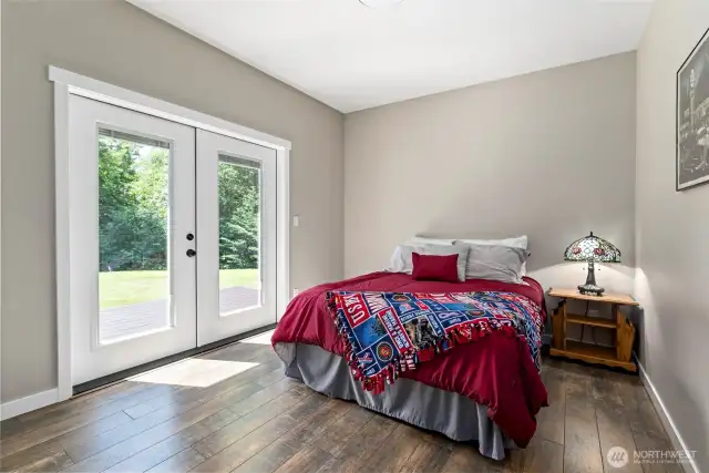 2nd guest bedroom with "blind in" french doors to the deck