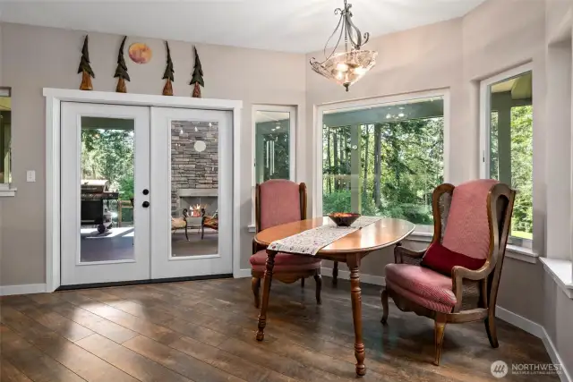 Dining nook with bay windows & french doors to the covered deck