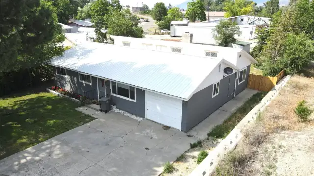 Lovely home with attached 1 car garage and detached shop