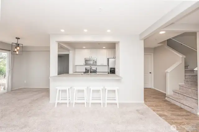 Front door View of kitchen, living room, dinning area, and the stairs leading to the 2nd floor