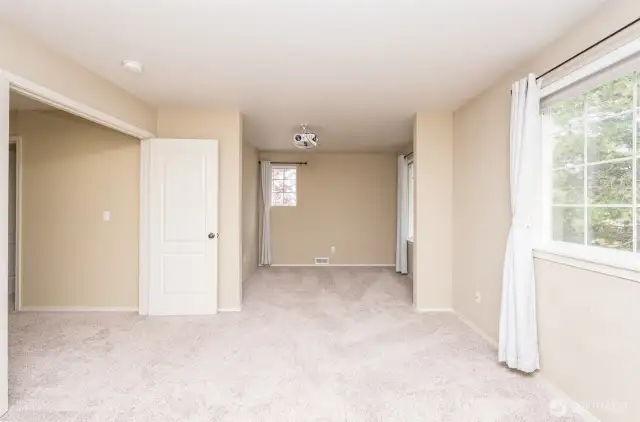 Upstairs 2nd primary bedroom with connecting bathroom. Projector is included.