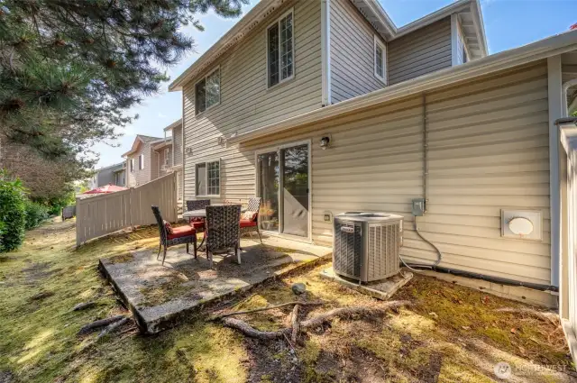 back yard area.  Patio furniture and umbrella included