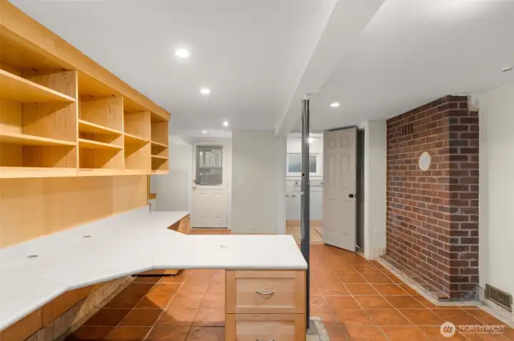 Daylight basement with separate entrance, bedroom, bathroom, laundry room, tons of storage.