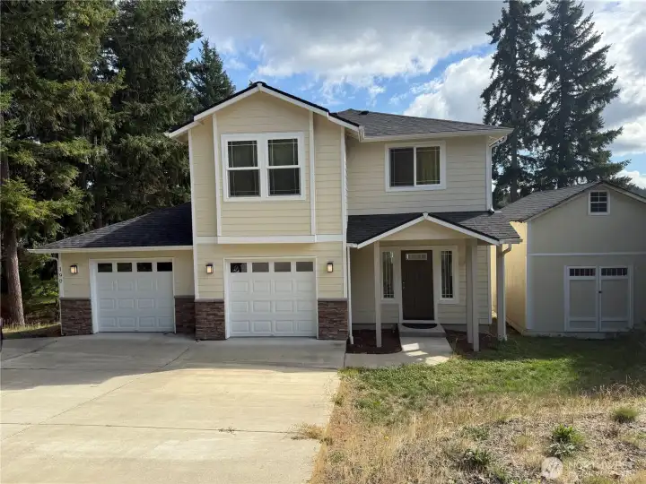 Front view of home and Large storage shed.