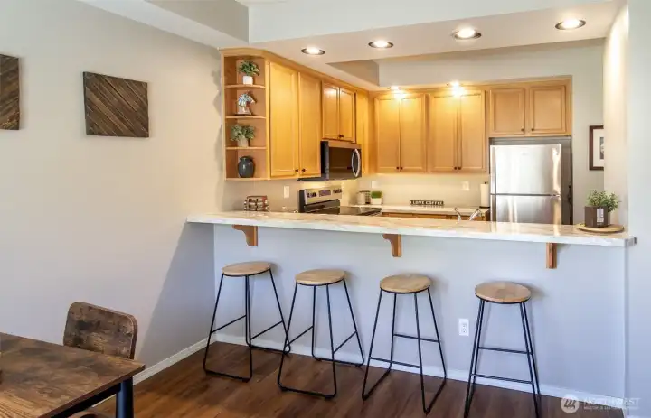 The bar height counter makes it easy to converse with guests while you are in the kitchen!