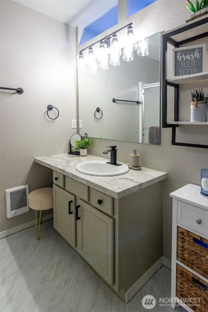 The en-suite bath is spacious and includes a vanity area too!