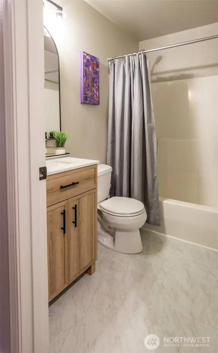 The main bath is spacious and has plenty of storage.