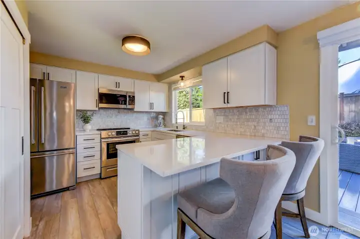 Beautiful new kitchen with new cabinets, quartz counters, new stainless sink & faucet!