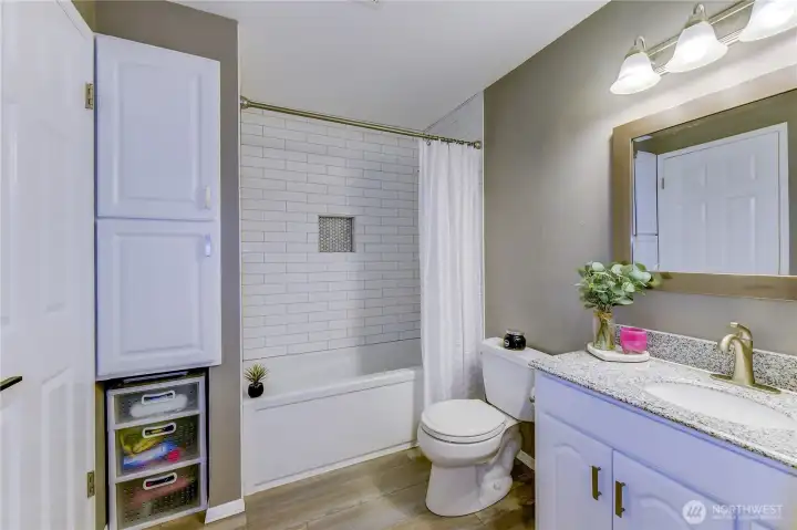 Beautifully updated bathroom with new tub & tile