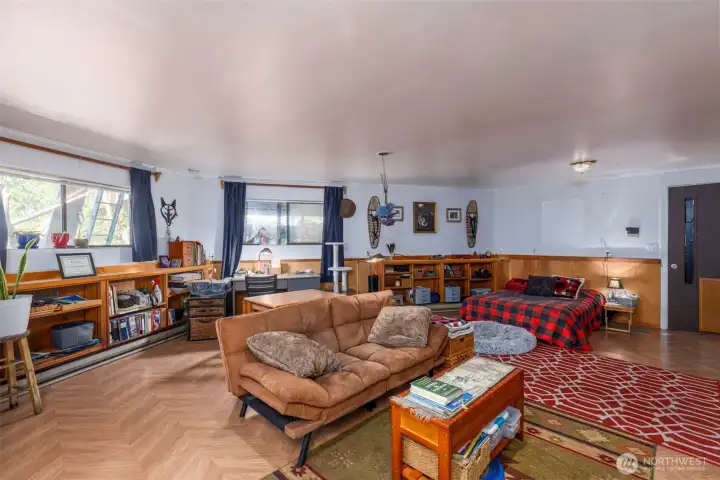 Each bedroom is beautifully appointed. This one features hardwood floors, a separate kitchenette and a private bathroom.