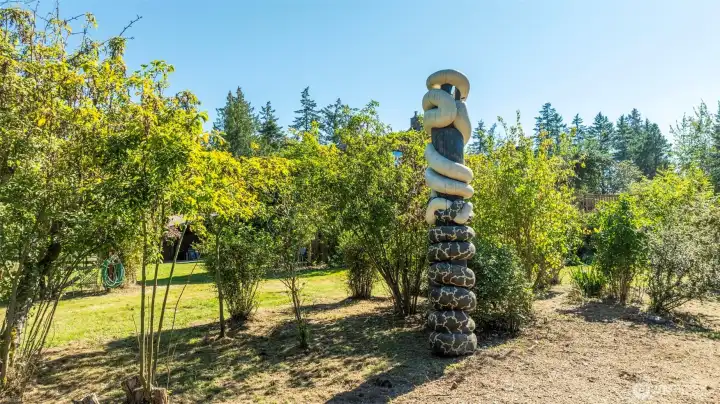 The gardens are as eloquent as the home itself, featuring this beautiful carving, fruit trees, and beautiful bridges and trails throughout.