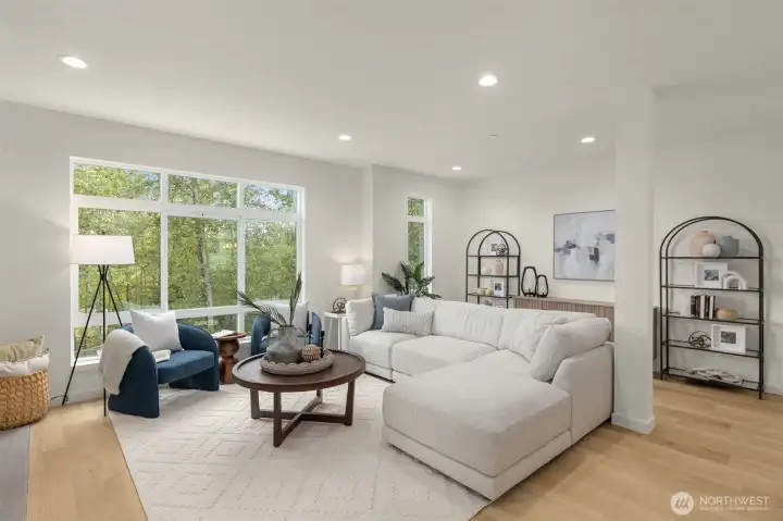 Sunlight spills into this inviting great room, where every window feels like a frame-worthy view. (photos of model home)