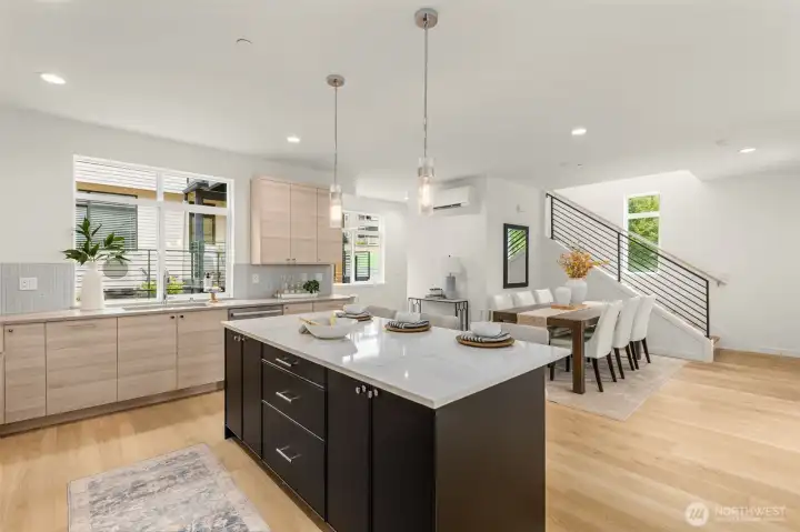 Expansive kitchen island—ideal for morning coffee, prepping meals, or casual dining with friends. (photos of model home)