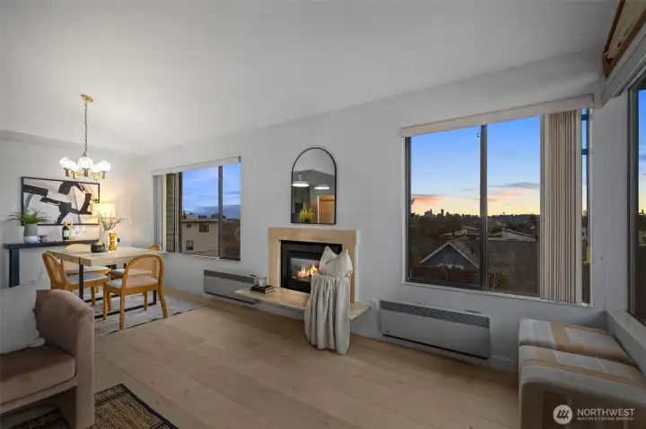 Stunning sunset views of the Seattle skyline, Space Needle, and mountains in this Southwest facing condo.