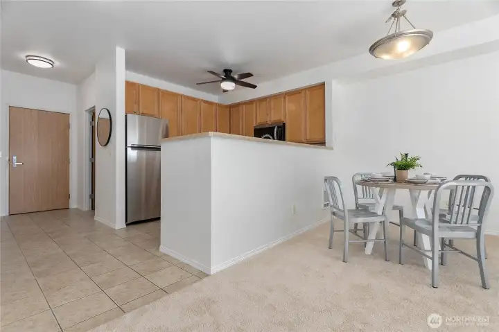 Dining nook right off the kitchen, with a view back to the entry.
