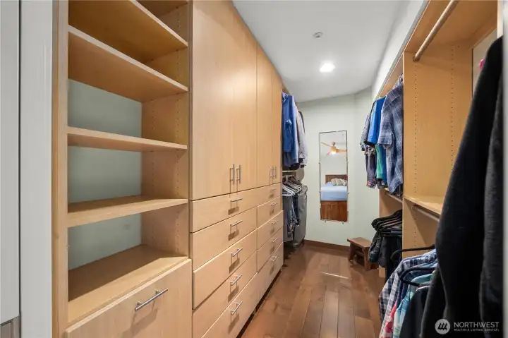 Primary bedroom with custom closet.