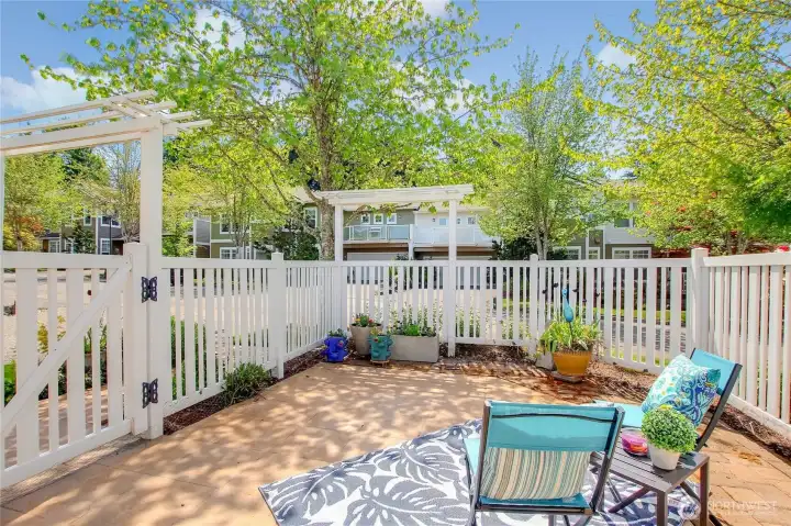 Garden gate with arbor over walkway.