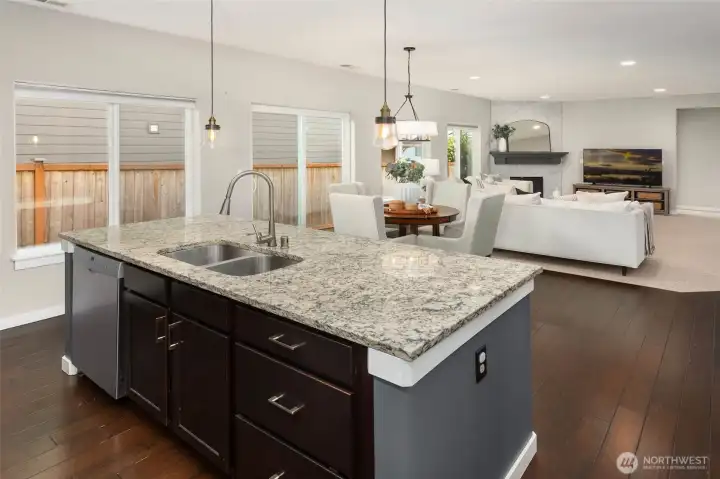 Kitchen flows seamlessly into the living area.