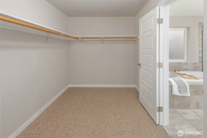 Primary walk-in closet.