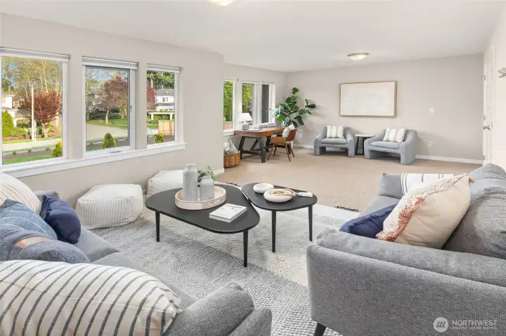 Expansive bonus room with a wall of windows.