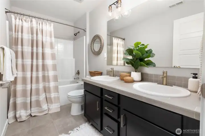 Full hallway bathroom on upper level.