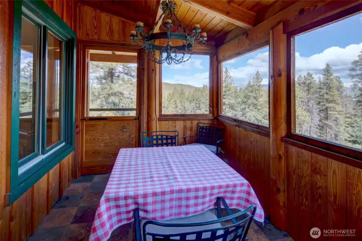 Off the dining area is a screened in porch offers a view. Off the dining area is a screened in porch offers a view.