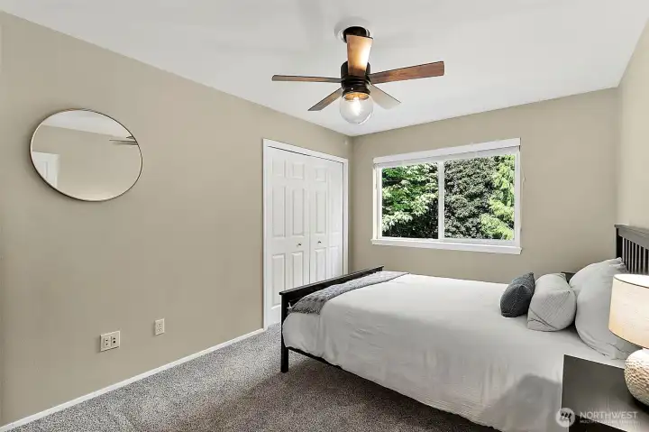 Additional room with two large windows, natural light, carpet flooring, neutral finishes, and flexible layout for bedroom or office use.